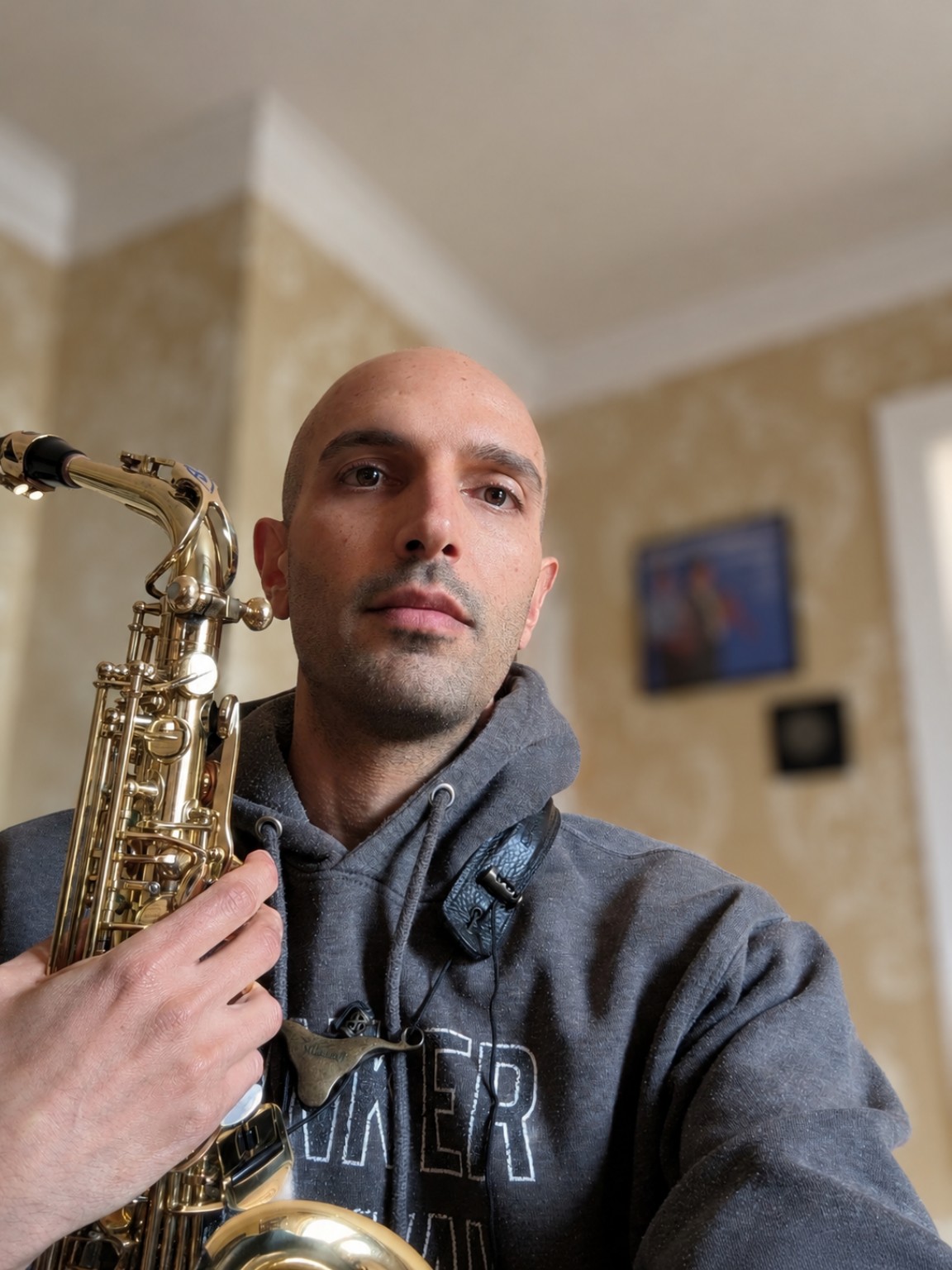 Erez Levi holding his saxophone